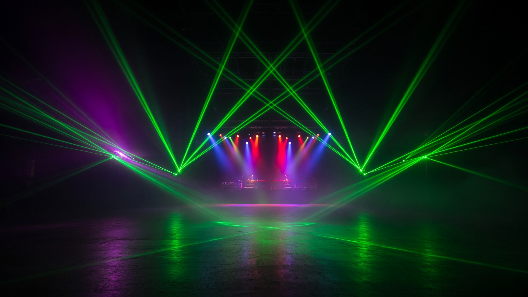 A tunnel of green lasers over a dark floor.
